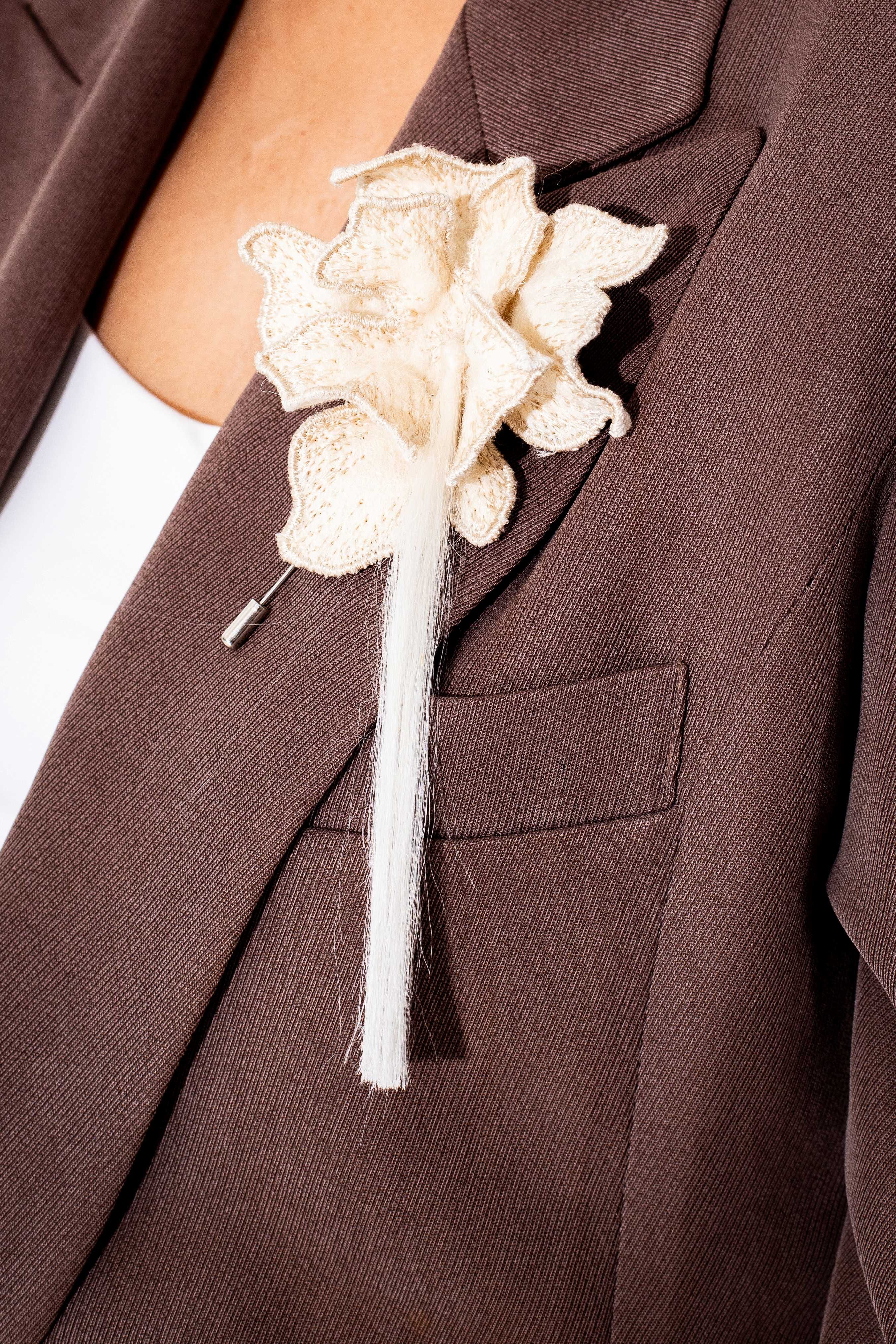 Dee Javier's "Letticia Brooch" is made from Hiblatech and piña fiber tassels.